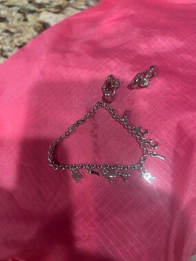 Nina Ricci silver bracelet and earrings